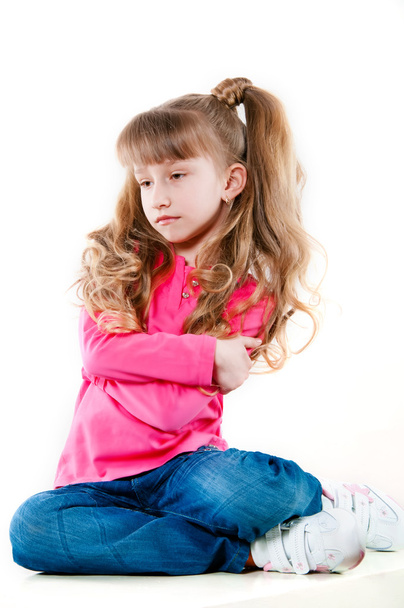 Little girl with long curly hair in a pink blouse - Foto, Bild