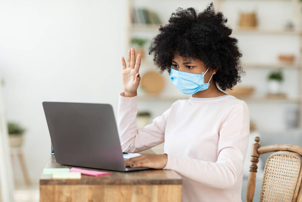 Sad African Girl In Mask Sitting At Laptop At Home - Photo, Image
