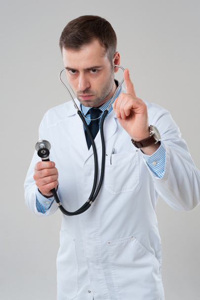 Doctor holds stethoscope - Fotoğraf, Görsel