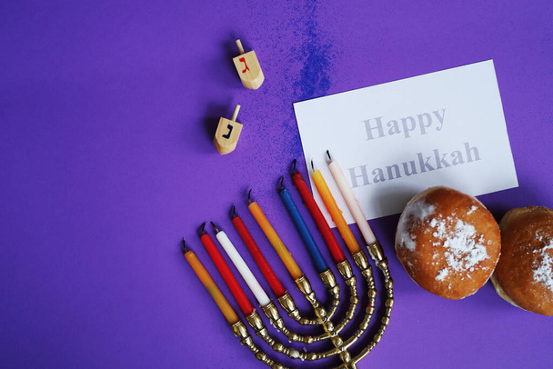 Jewish holiday Hanukkah and its famous nine-branched menorah - Foto, Imagen