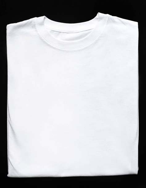 White shirt on a black background - Fotó, kép