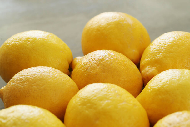 Fresh lemons on the table - Φωτογραφία, εικόνα