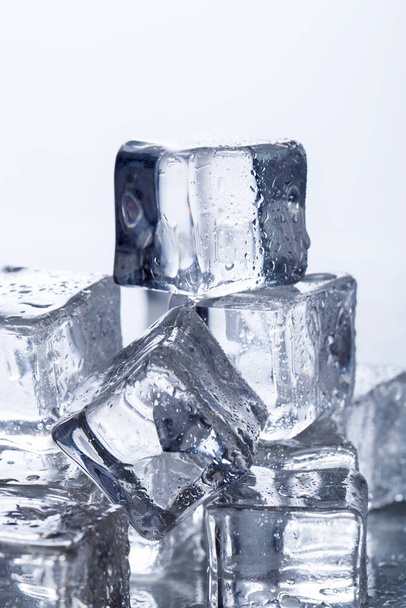 Cold. Frozen ice cubes on the table - Fotó, kép