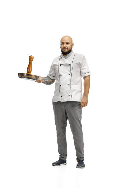 Portrait of a male chef cook, butcher isolated on a white studio background - Foto, afbeelding