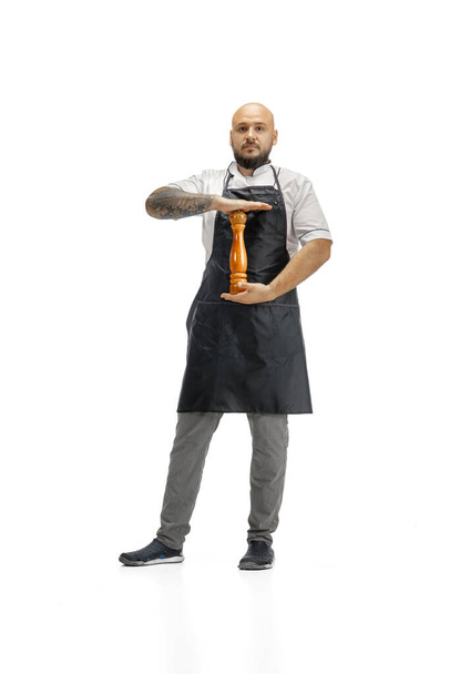 Portrait of a male chef cook, butcher isolated on a white studio background - Photo, image
