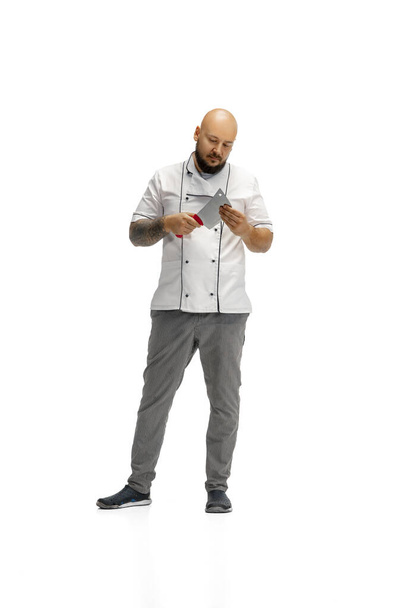 Portrait of a male chef cook, butcher isolated on a white studio background - Fotó, kép