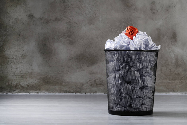 Concept. Creased paper in a trash can - Фото, изображение
