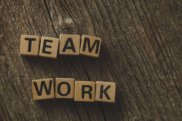 Words, teamwork. Toy bricks on the table - Фото, изображение