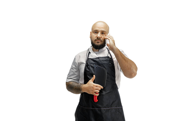 Portrait of a male chef cook, butcher isolated on a white studio background - Foto, immagini