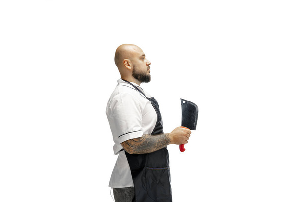 Portrait of a male chef cook, butcher isolated on a white studio background - 写真・画像