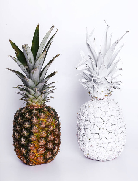 Fancy, white pineapple on the table - Фото, изображение