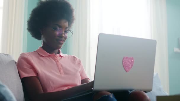 Beautiful Black Woman Is Working at Laptop and Talking to Roommate - Felvétel, videó
