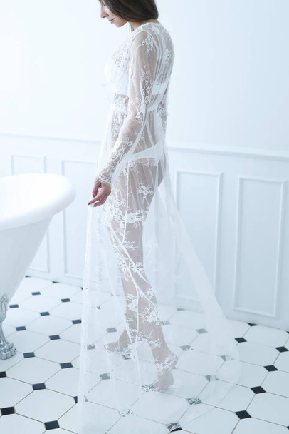 Fashion. Woman posing in white dress - Foto, Imagem