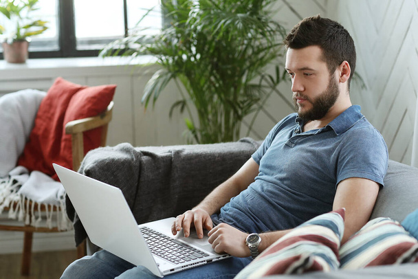 Lifestyle. Handsome man with laptop - Photo, Image