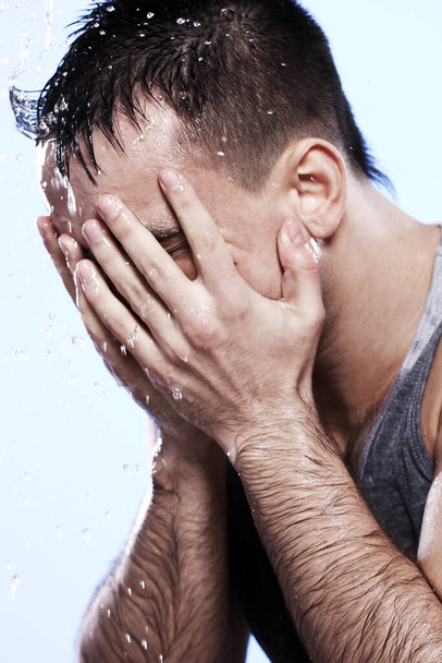Handsome guy washing his face - Φωτογραφία, εικόνα