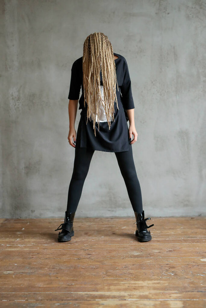 Hairstyle and fashion. Woman with dreadlocks - Фото, изображение
