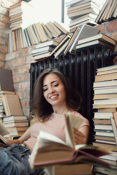 Education and books. Lovely woman in the library - Foto, Imagem