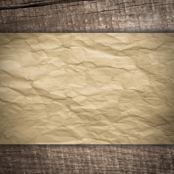 Old paper on wooden background - Photo, Image