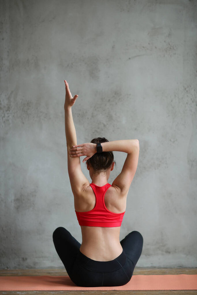 Lifestyle. Woman practicing yoga at home - 写真・画像