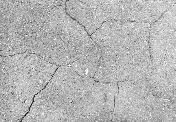 Scheuren op oude beschadigde asfalt achtergrond textuur - Foto, afbeelding