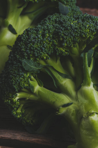 Delicious broccoli on a wooden table - 写真・画像