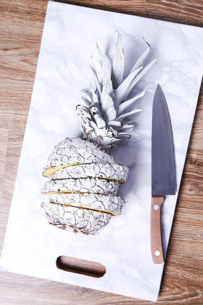 Fancy, white pineapple on the board - Photo, Image