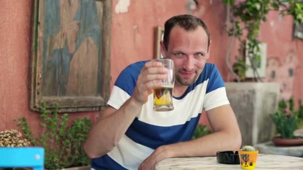 Man raising toast with beer - Materiał filmowy, wideo
