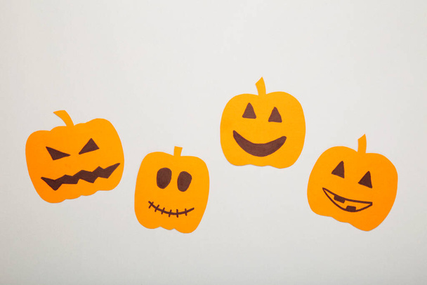 Halloween decorations with paper pumpkins on grey background. Top view - Photo, Image