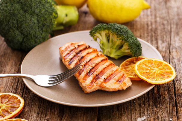 Slice of grilled salmon on a dish - Photo, Image