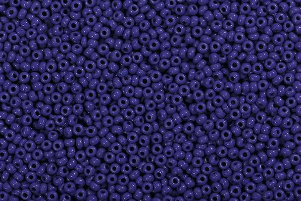 Dark blue beads in texture form close up. - Photo, Image