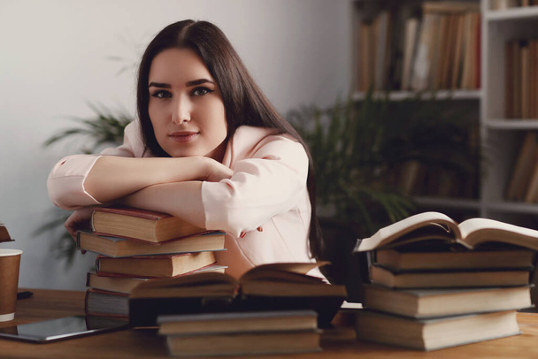 Education and study. Woman in the library - Valokuva, kuva