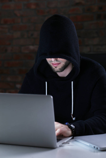 Hacker in front of his computer - Фото, изображение