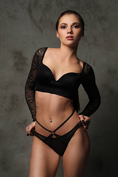Lovely woman in beautiful, black lingerie - Фото, изображение