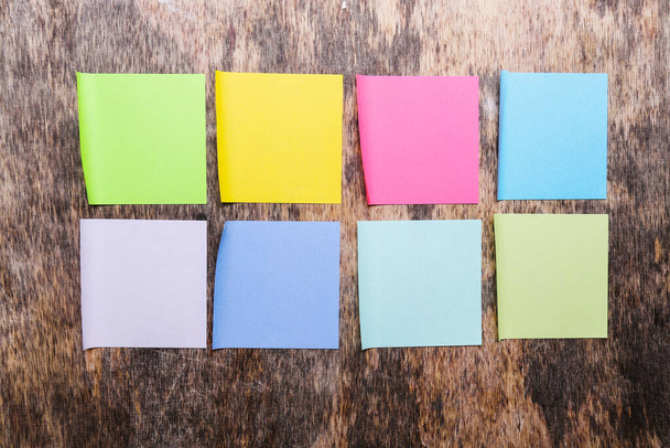 Colorful sticky notes on the wooden table - Photo, Image