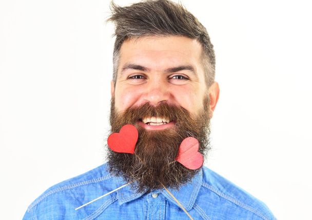 Romantic mood concept. Man with re hearts in his beard. Love and romance. - Fotó, kép