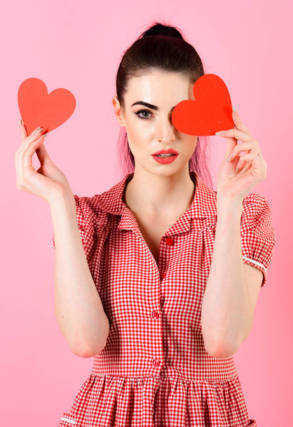Sexy girl concept. Sexy girl with make up holding red hearts - Φωτογραφία, εικόνα