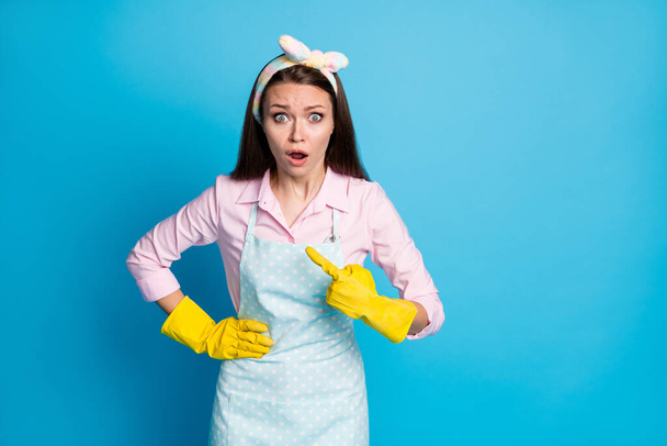 Portrait of her she nice attractive lovely worried girl washer maid pointing at herself guilty dirty dusty floor home isolated over bright vivid shine vibrant blue color background - Foto, Imagen