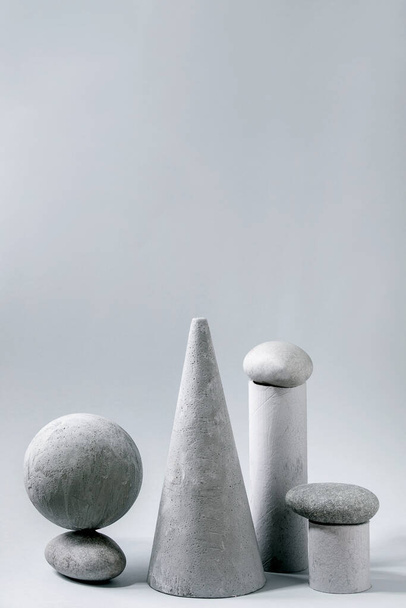 Abstract background with composition of different grey geometric objects and stones. Copy space. Modern concept for product presentation. - Foto, Imagem