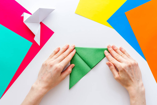DIY concept. Doing origami paper bird, Top view - Foto, imagen