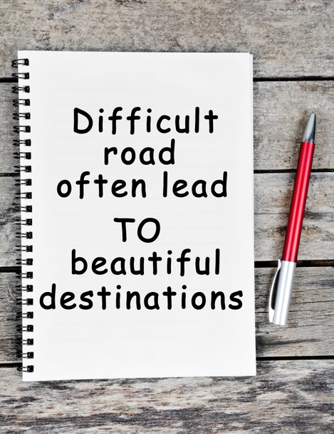 inspirational and motivational quote of difficult roads often lead to beautiful destinations on notebook page - Photo, Image