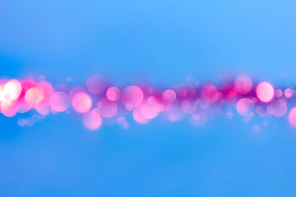 Abstract blue background with red round bokeh in the center - Photo, Image