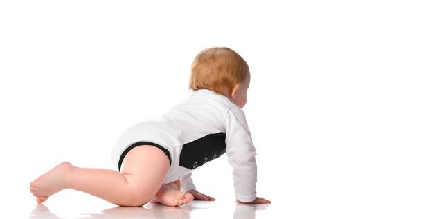 Adorable blonde baby in underwear crawling isolated on a white background. - Foto, Imagem