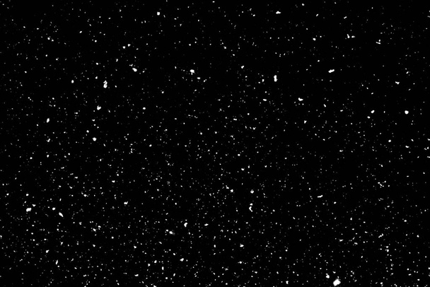 Chaotyczny biały bokeh na czarnym tle, tekstura plamy światła, abstrakcja, spadający śnieg - Zdjęcie, obraz