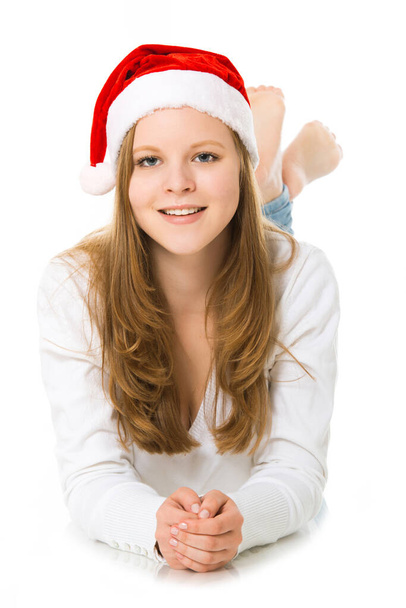 Adolescente con cappello da Babbo Natale isolato su bianco - Foto, immagini