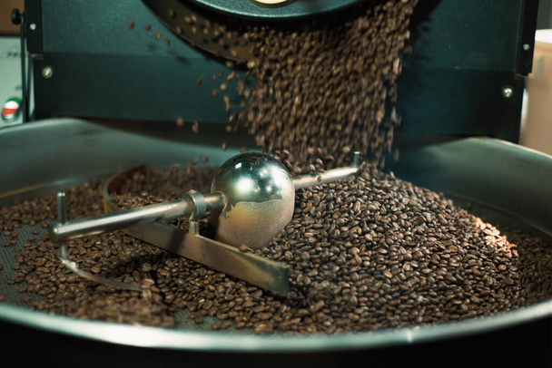 Close up photo of coffee roasting machine in process. - 写真・画像