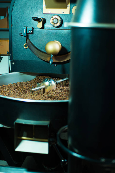 Close up photo of coffee roasting machine in process. - Photo, Image