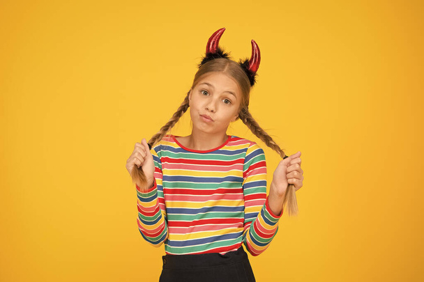 Accessories for carnival. Preparing for party. Small demon. Playful demon girl. Little demon inside. Girlish temper. Cute but dangerous. Halloween concept. Small adorable child with red horns - Foto, Bild