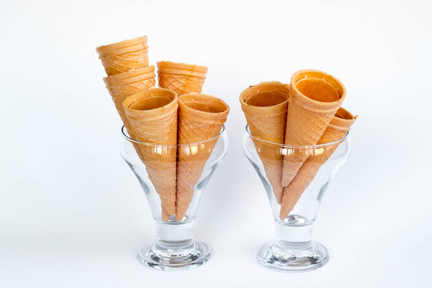 Crispy,Conical Cornets of Ice Cream in transparent glass on the white surface.Close up taken. - Fotografie, Obrázek