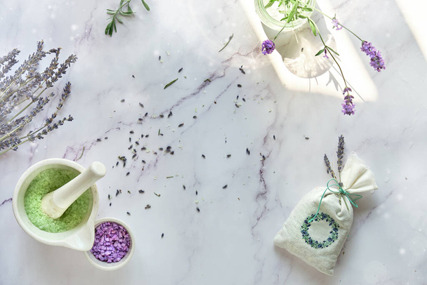 Handmade lavender sachets and home made sugar scrub. Fresh and dry lavender flowers. Flat lay on white marble. - Foto, imagen