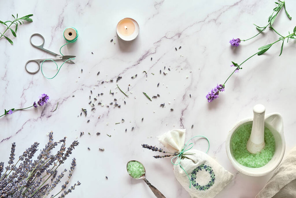 Handmade lavender sachets and homemade bath salt. Lavender flowers, fresh and dry. Flat lay on white marble. - Fotoğraf, Görsel